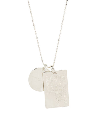 close-up-back-view-of-spell-s-scorpio-stargazer-zodiac-necklace-charms-one-charm-is-of-a-rectangular-shape-and-an-inspirational-quote-while-the-other-charm-is-circular-the-brand-name